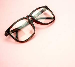 pair of glasses on a pink background